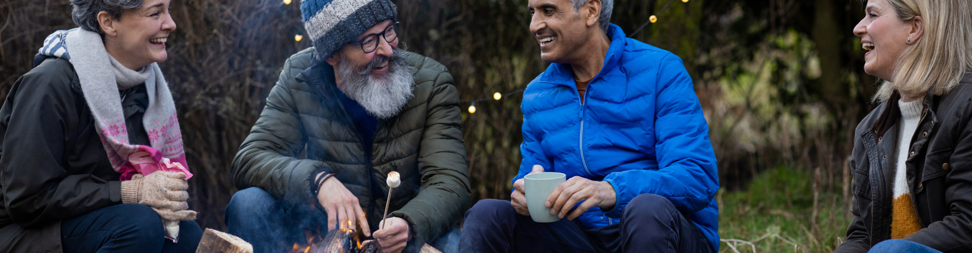 A group of people sitting outside.