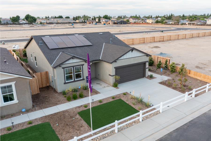 A house with a fence around it.