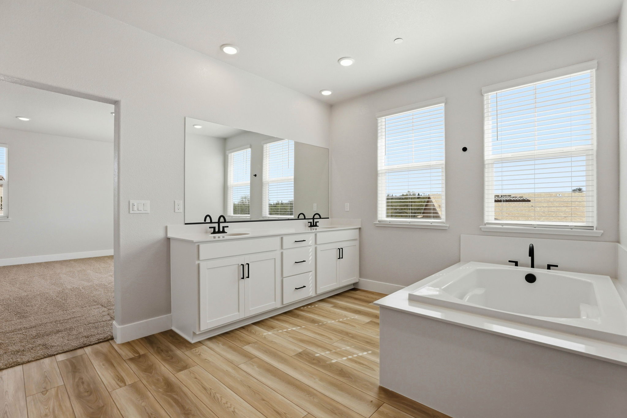 A bathroom with a tub and sink.