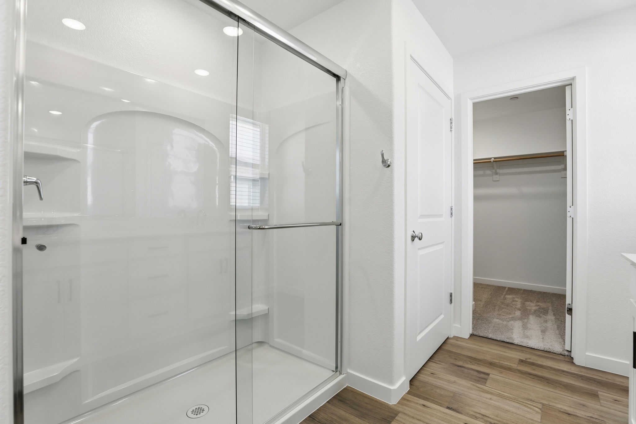 A bathroom with a glass shower.