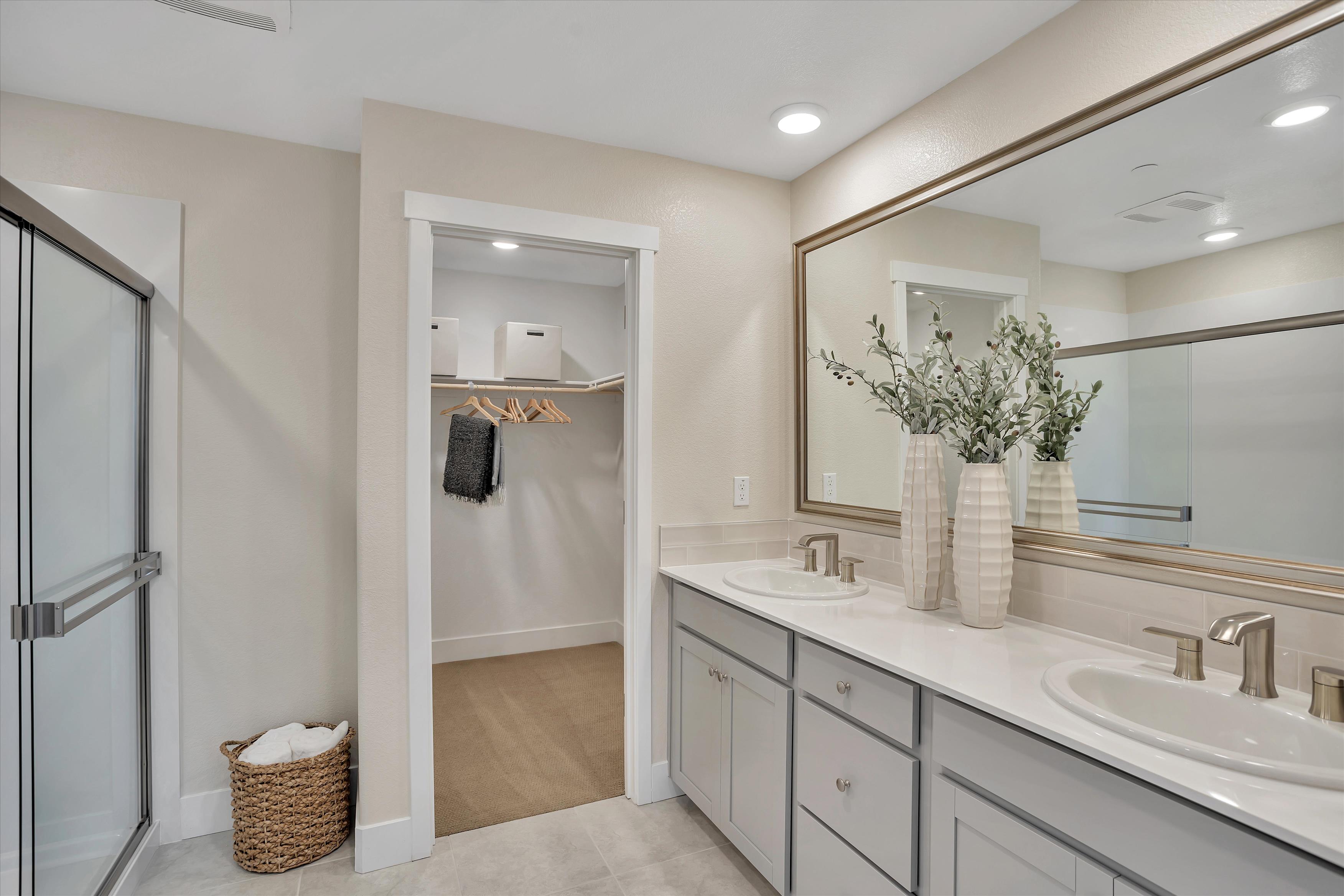 A bathroom with a shower and sink.