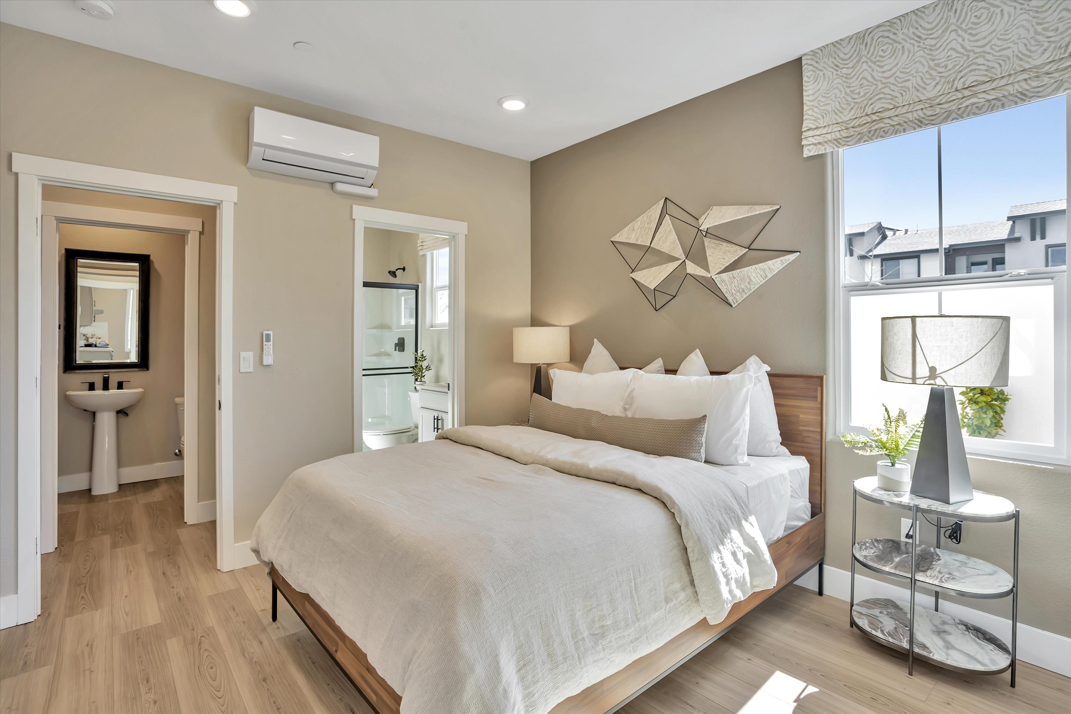 A bedroom with a large bed.