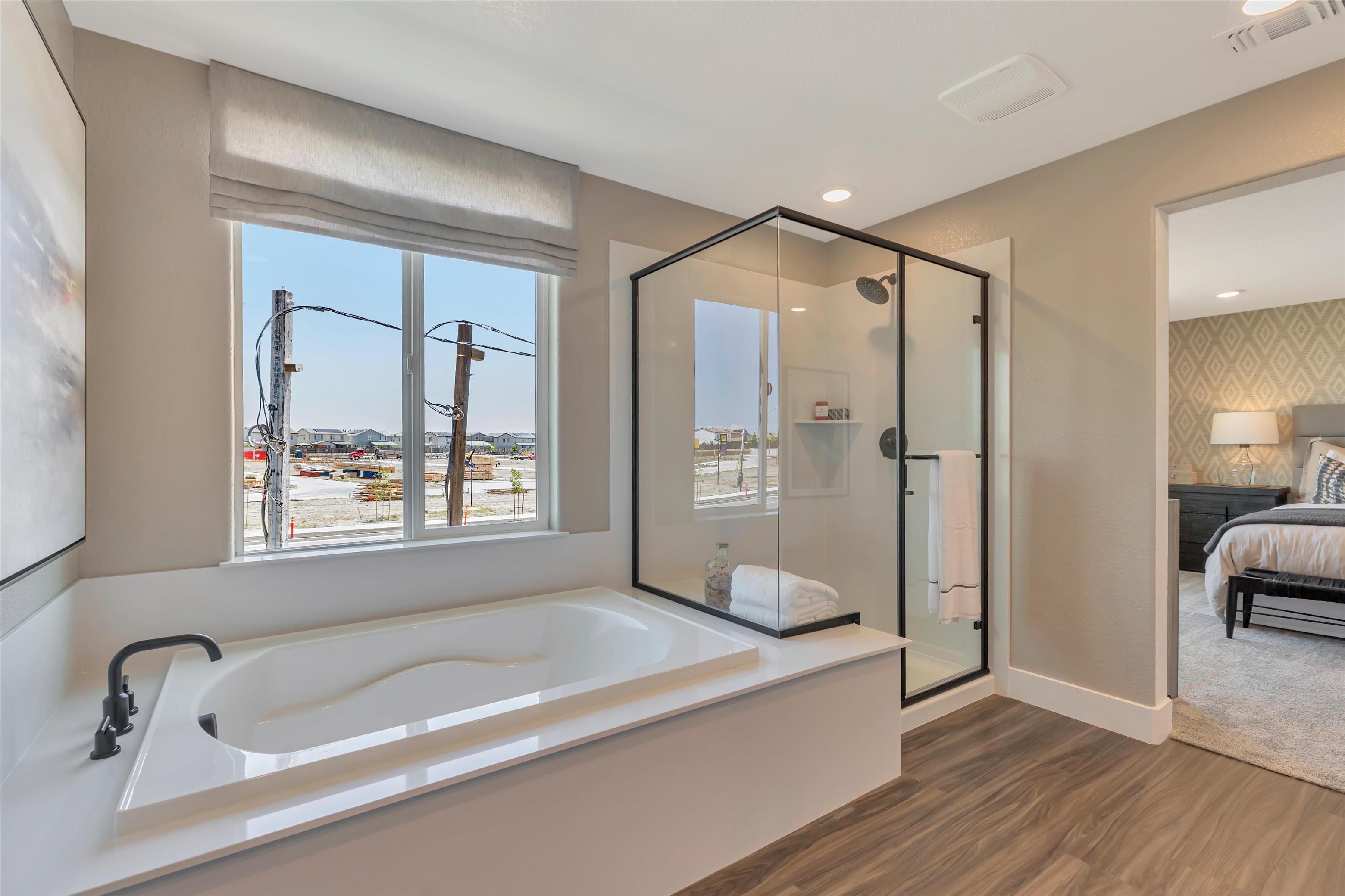 A bathroom with a large tub.