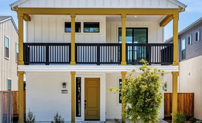 A building with a yellow and black railing.