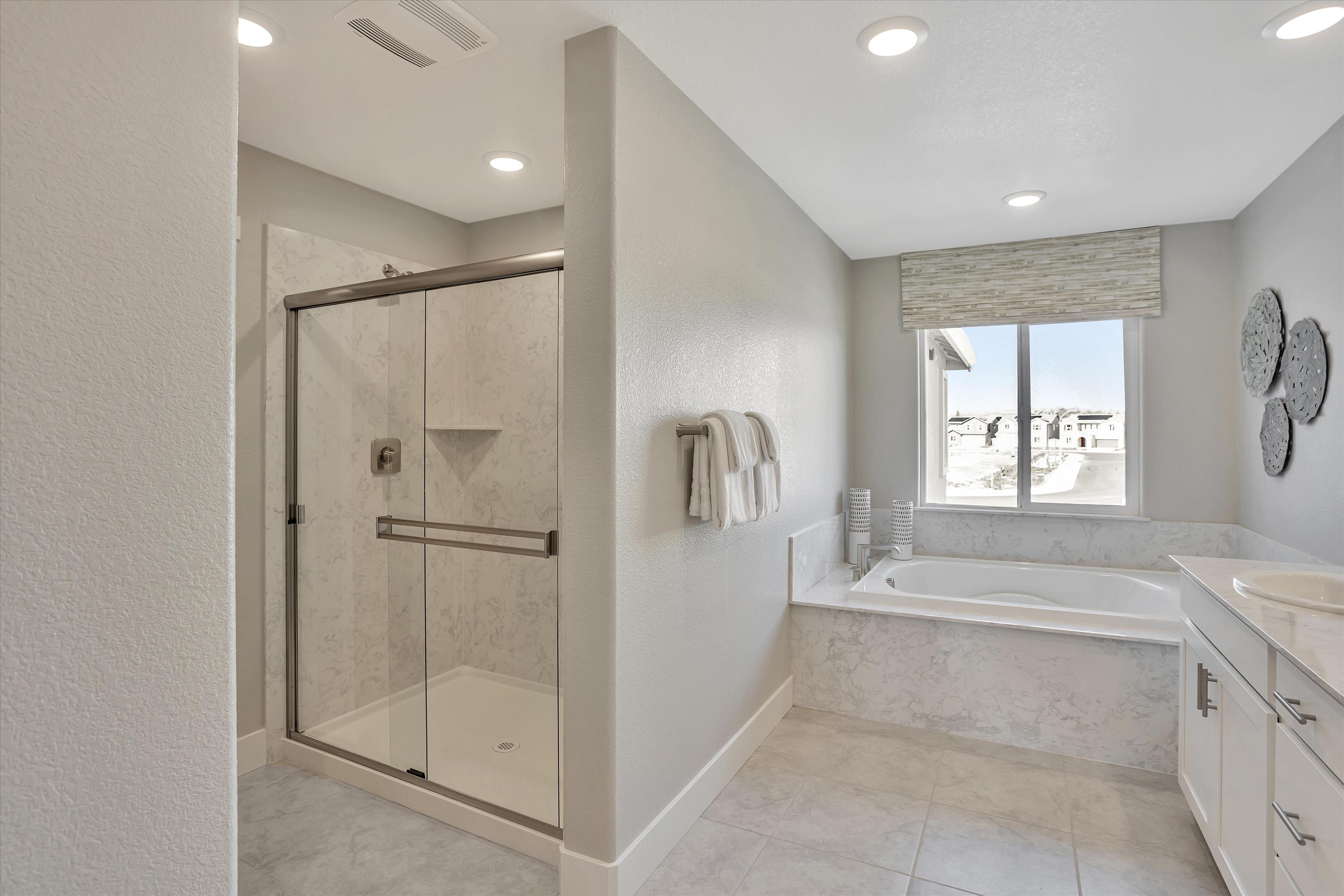 A bathroom with a glass shower.