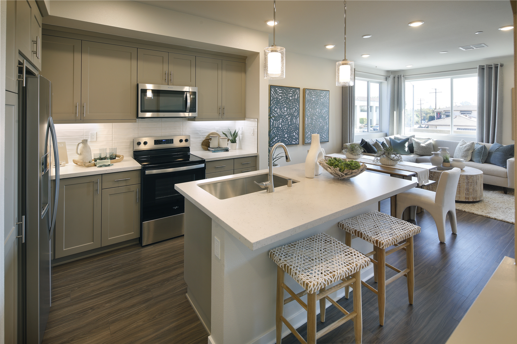 A kitchen with a bar stool and a bar stool.