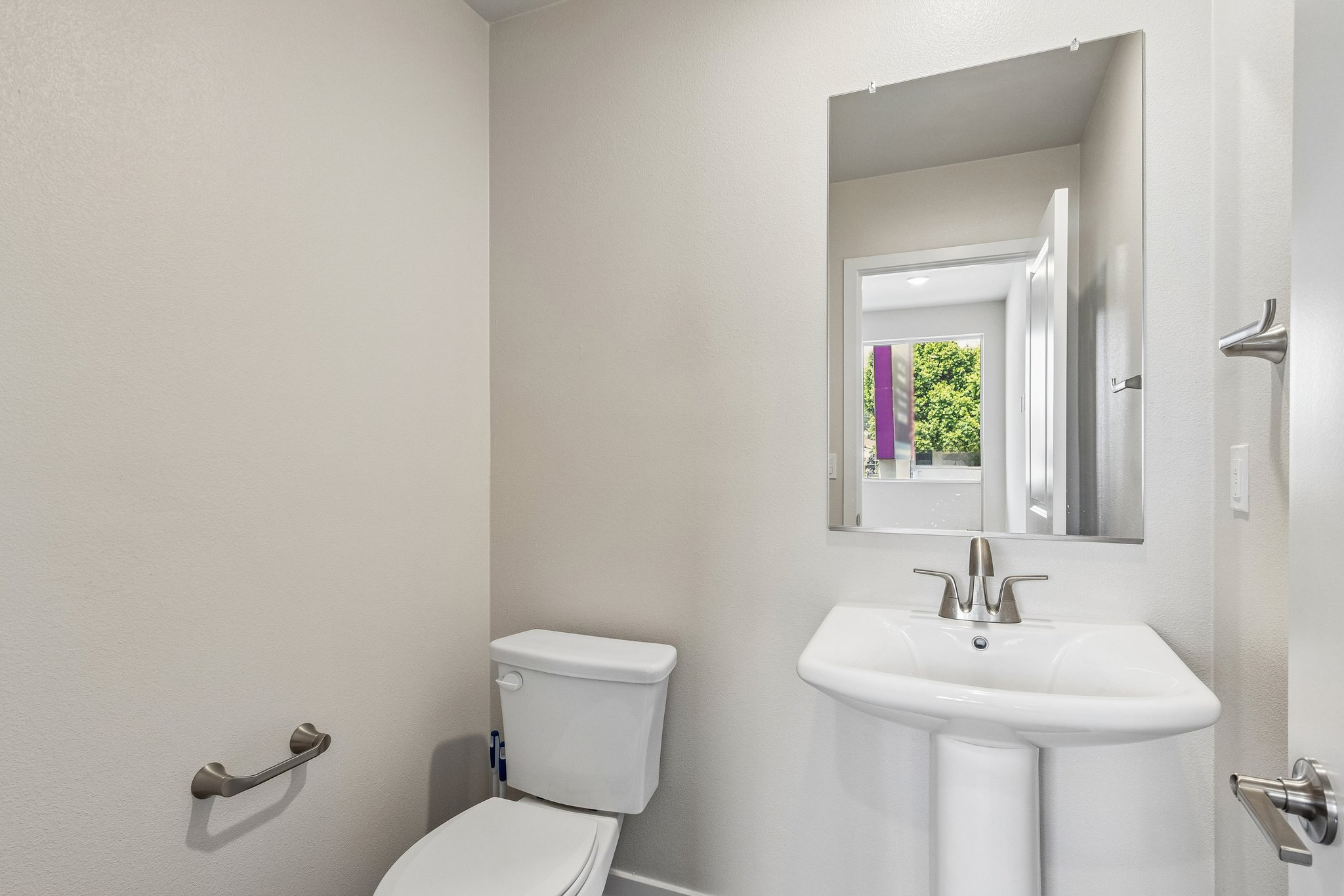 A bathroom with a sink and toilet.