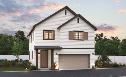 A white house with a garage.
