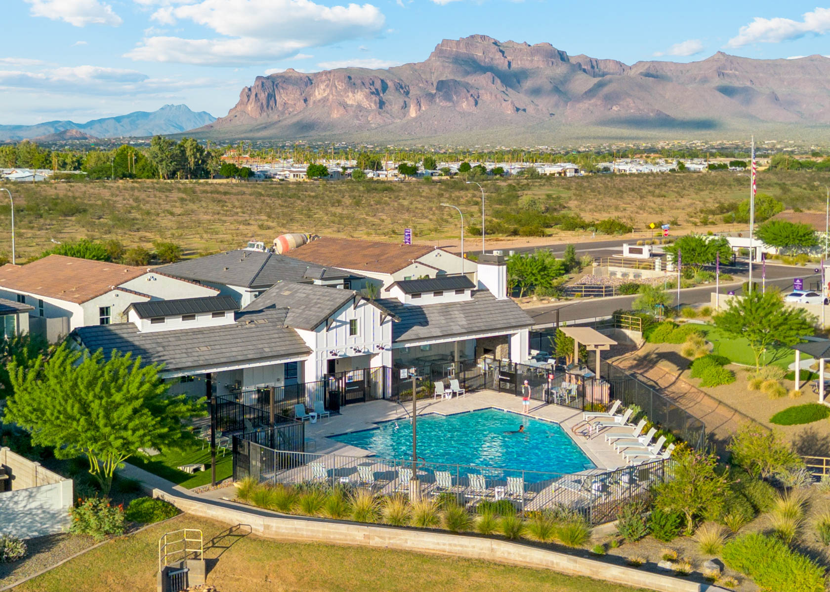 A large building with a pool in the front.