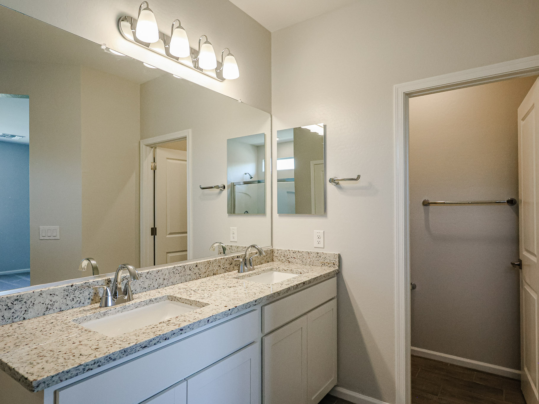 A bathroom with a marble countertop.