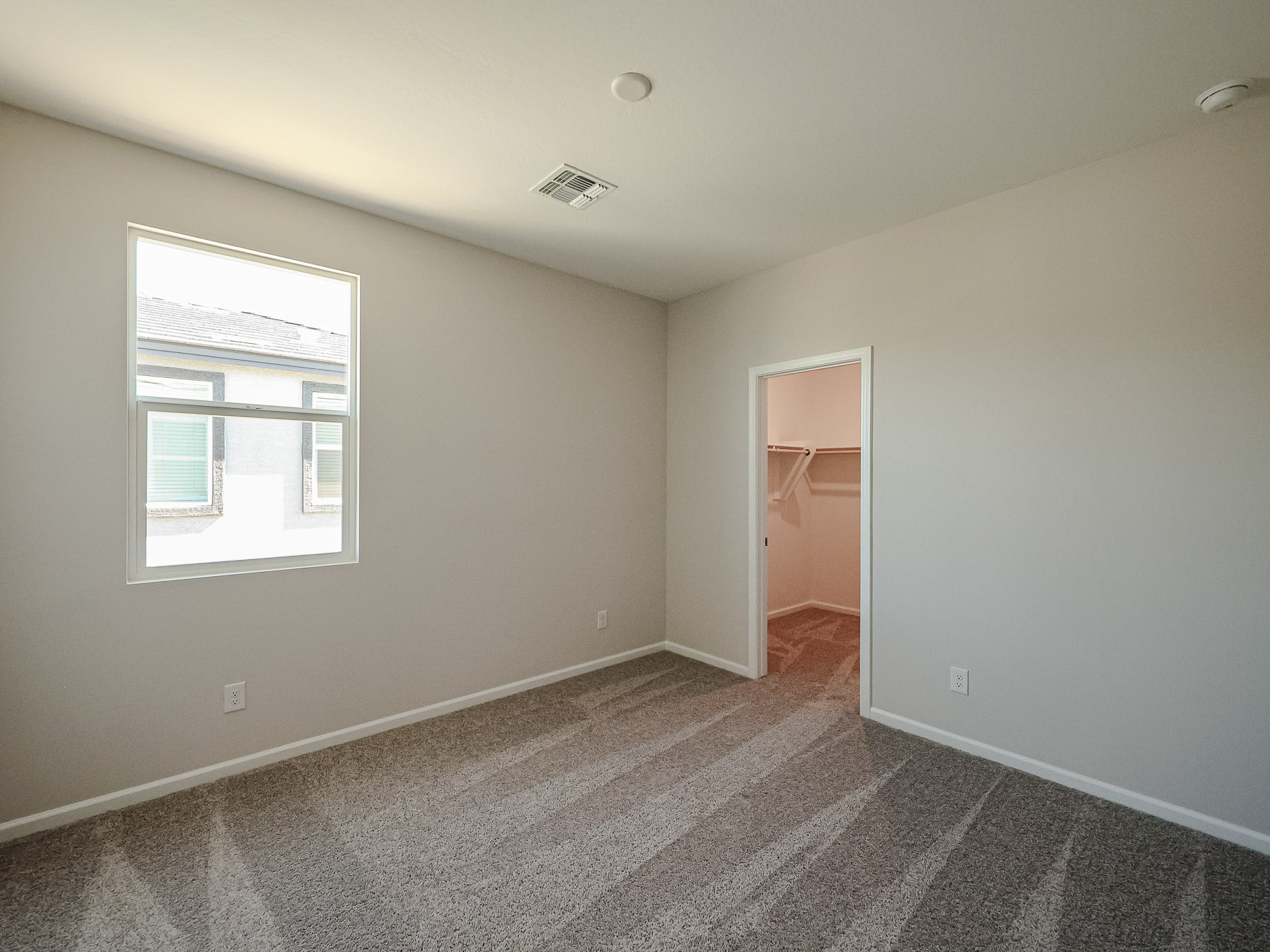 A room with a door and a window.