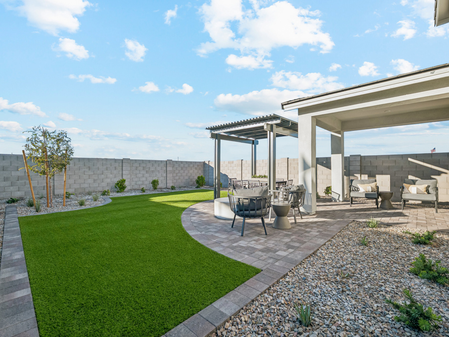 A patio with a table and chairs.