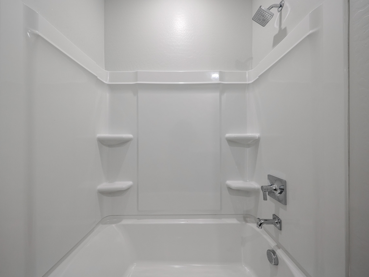 A bathroom with a toilet and sink.