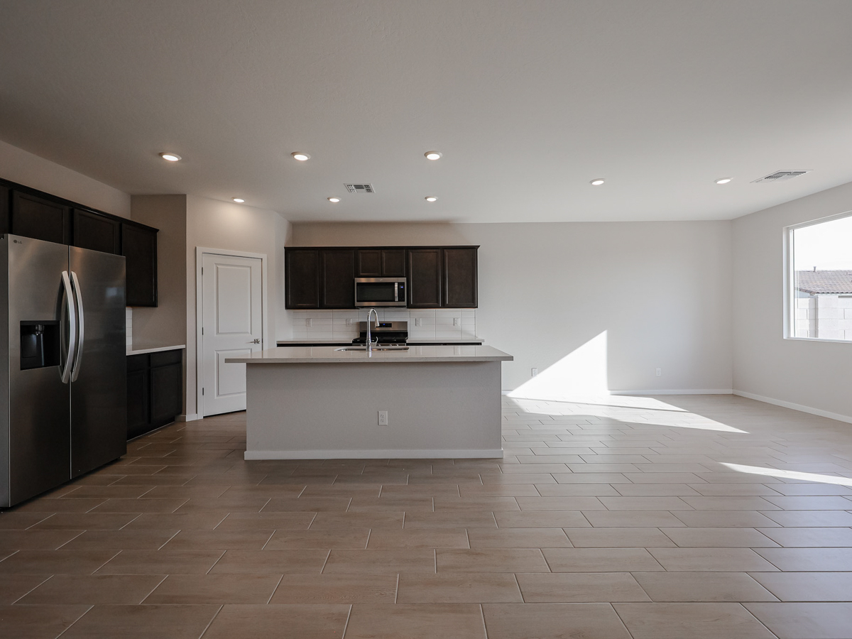 A kitchen with black appliances.