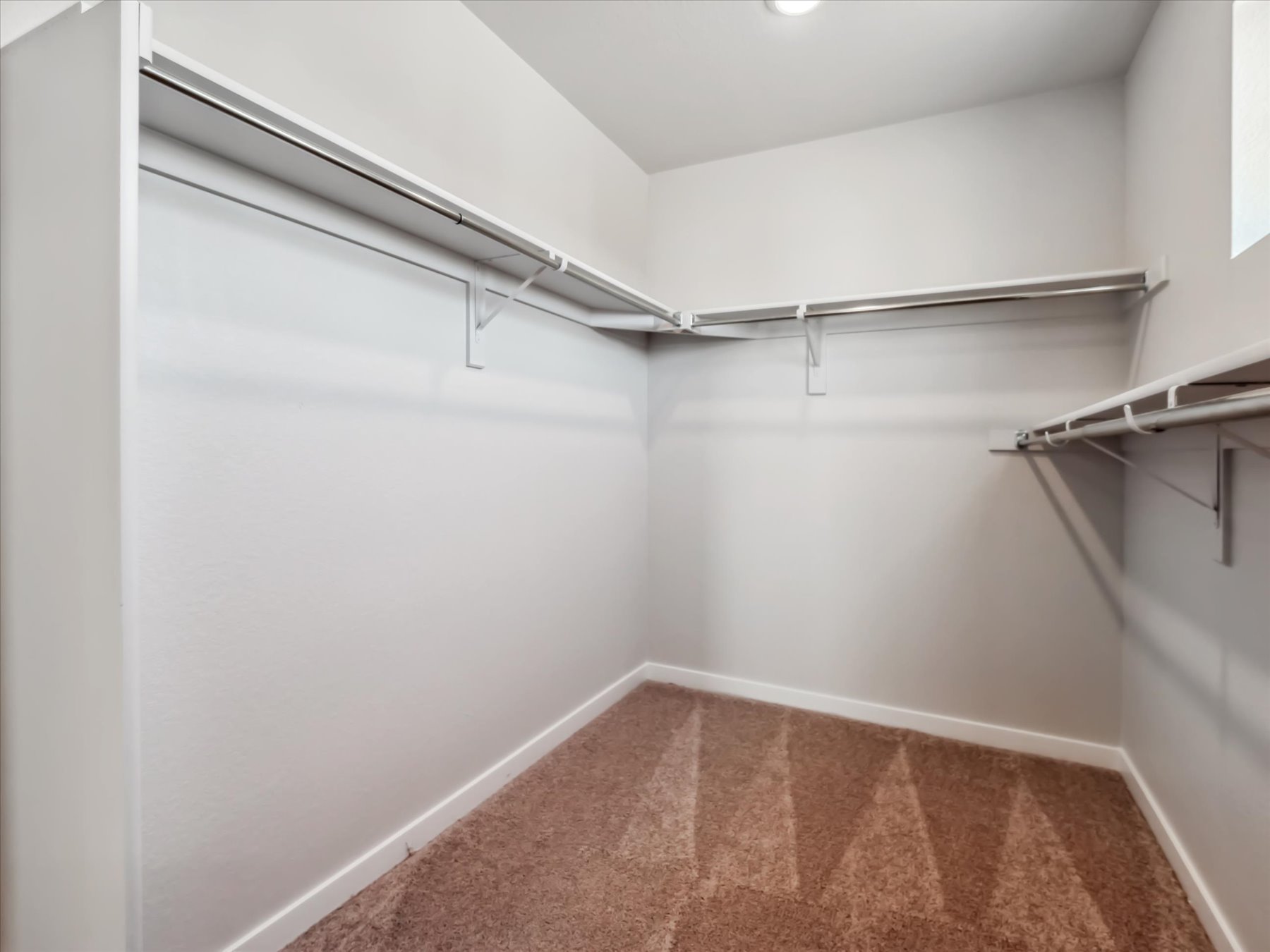 A white room with a tile floor.