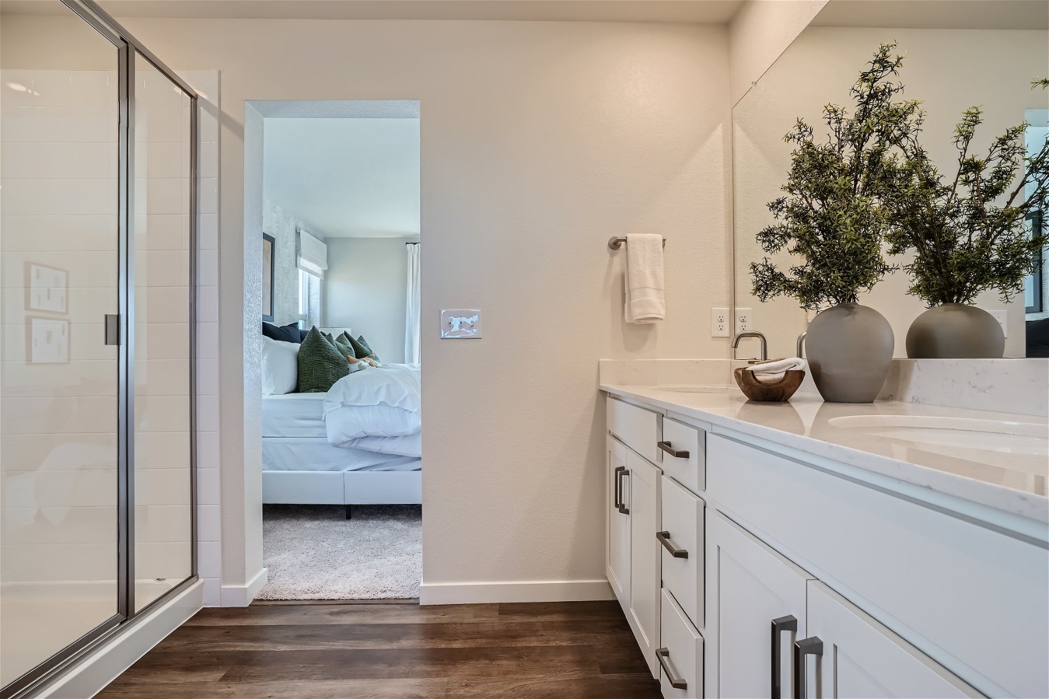 A bathroom with a glass door.