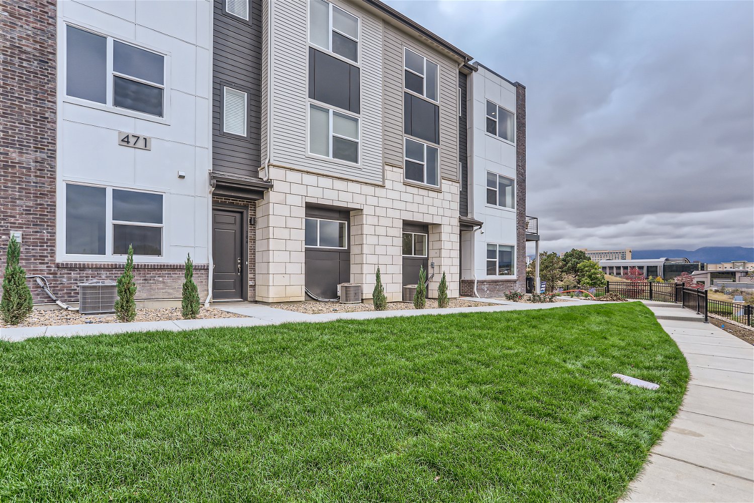 A building with a grass lawn.