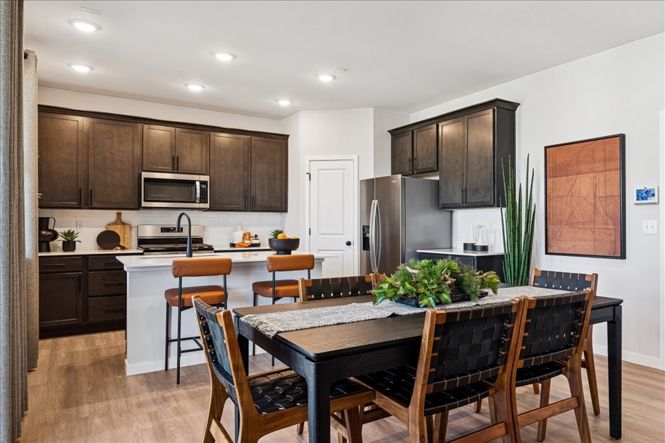 A kitchen with a dining table.