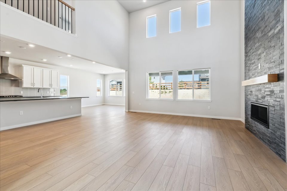 A large white room with a fireplace.