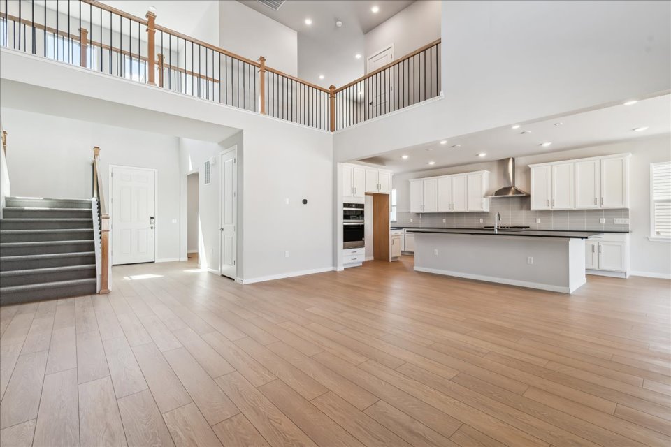 A large kitchen with white cabinets.