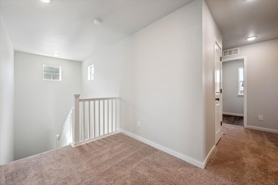 A hallway with a railing.