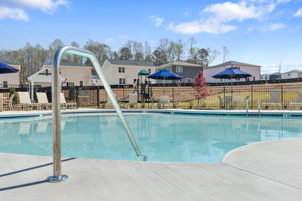A pool with a slide in it.