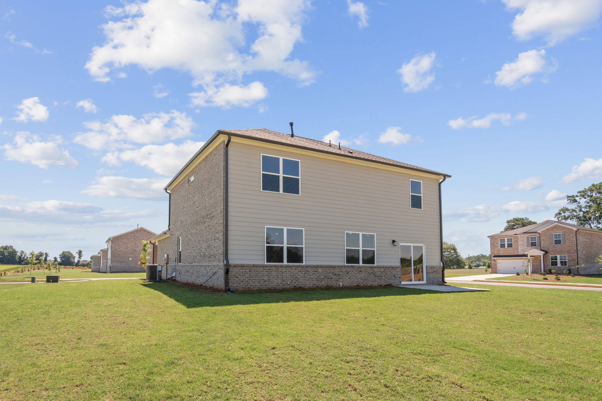 A house with a grass yard.