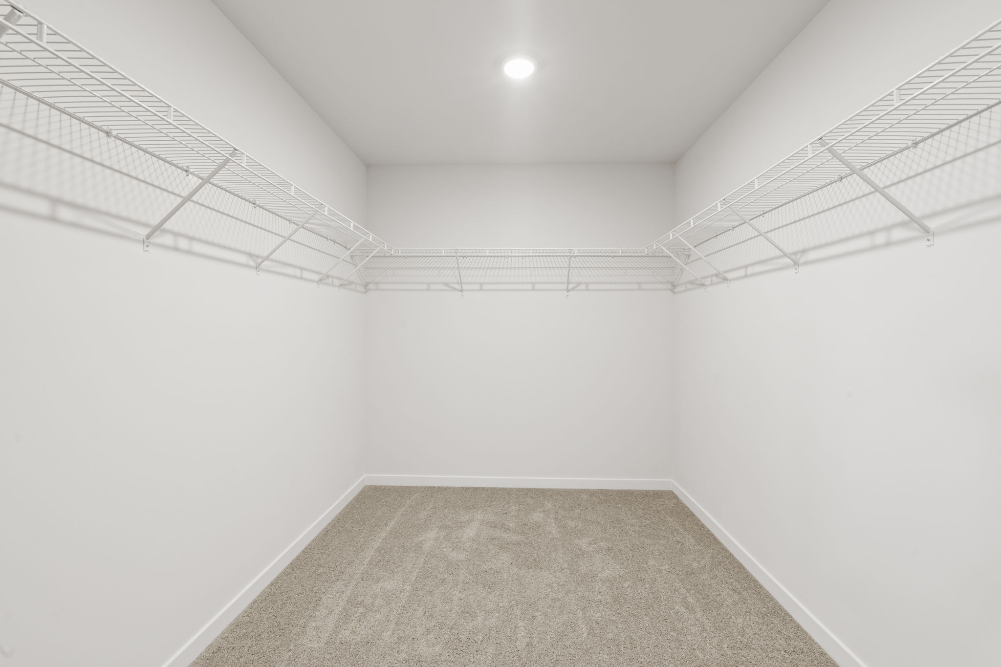 A hallway with white walls.