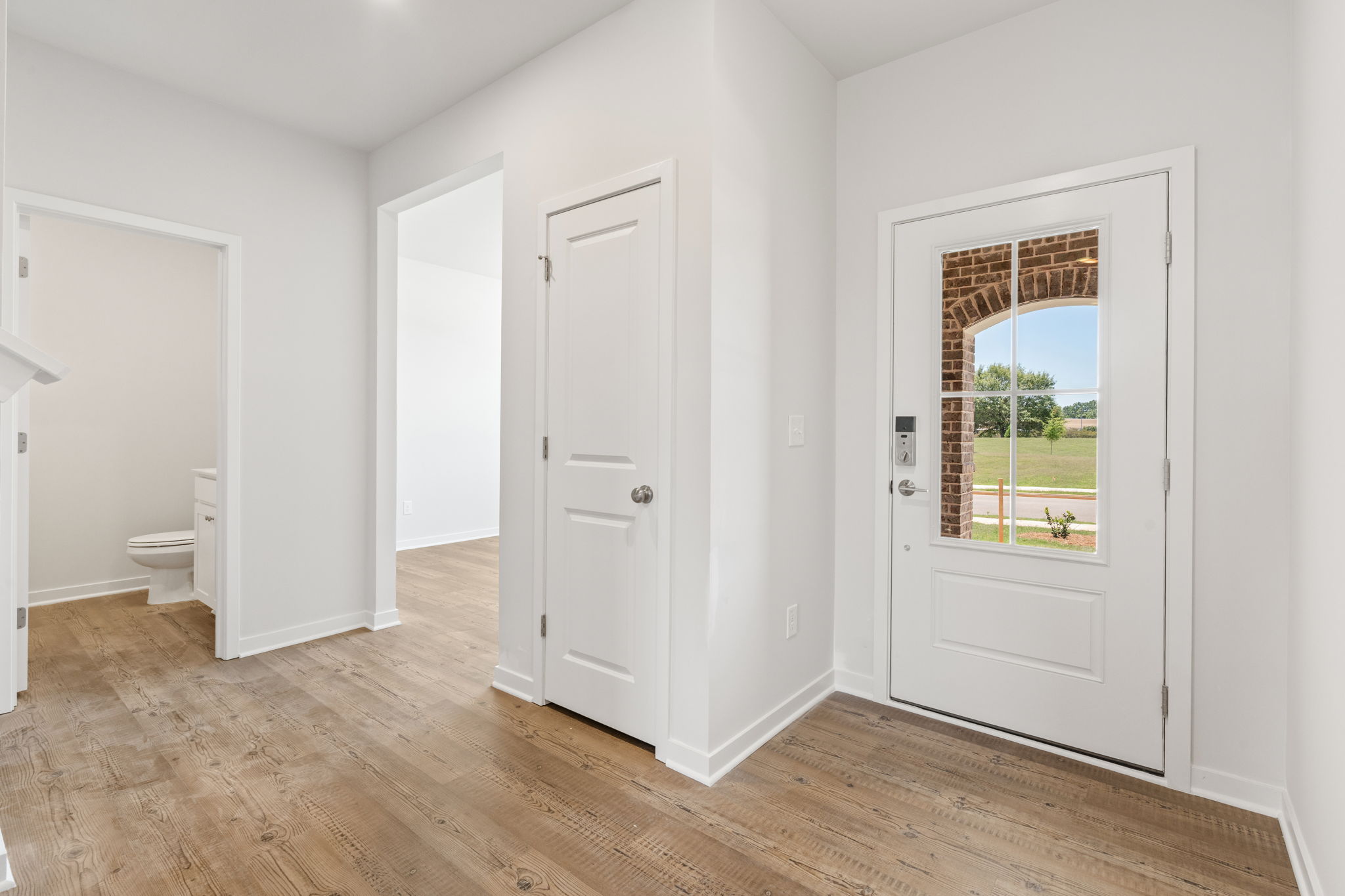 A bathroom with white doors.