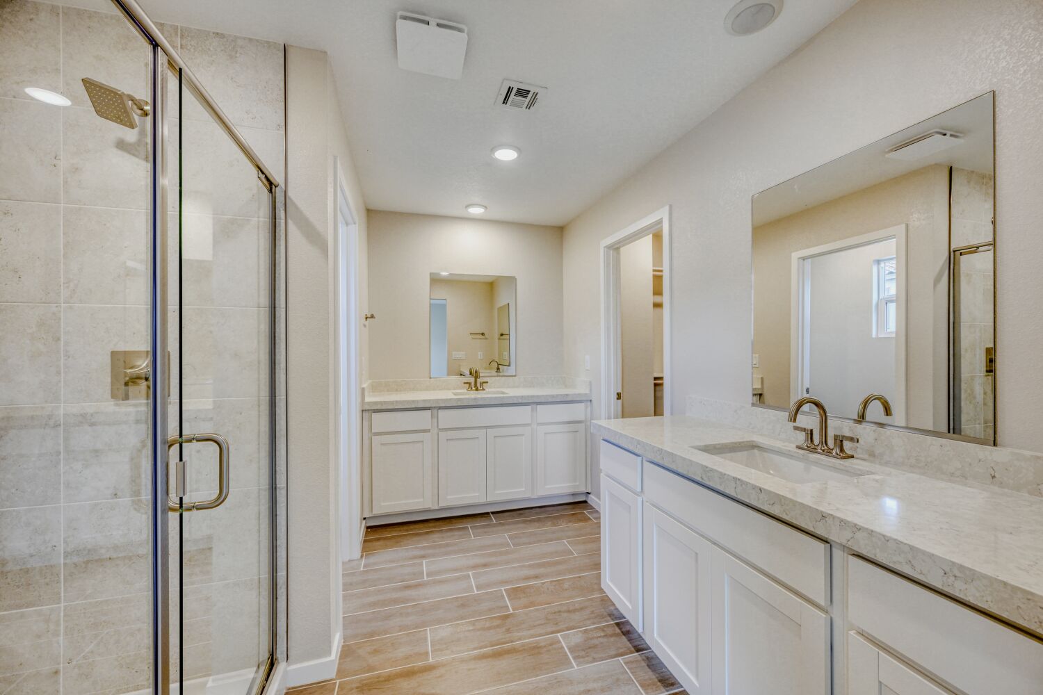 A bathroom with a glass shower.