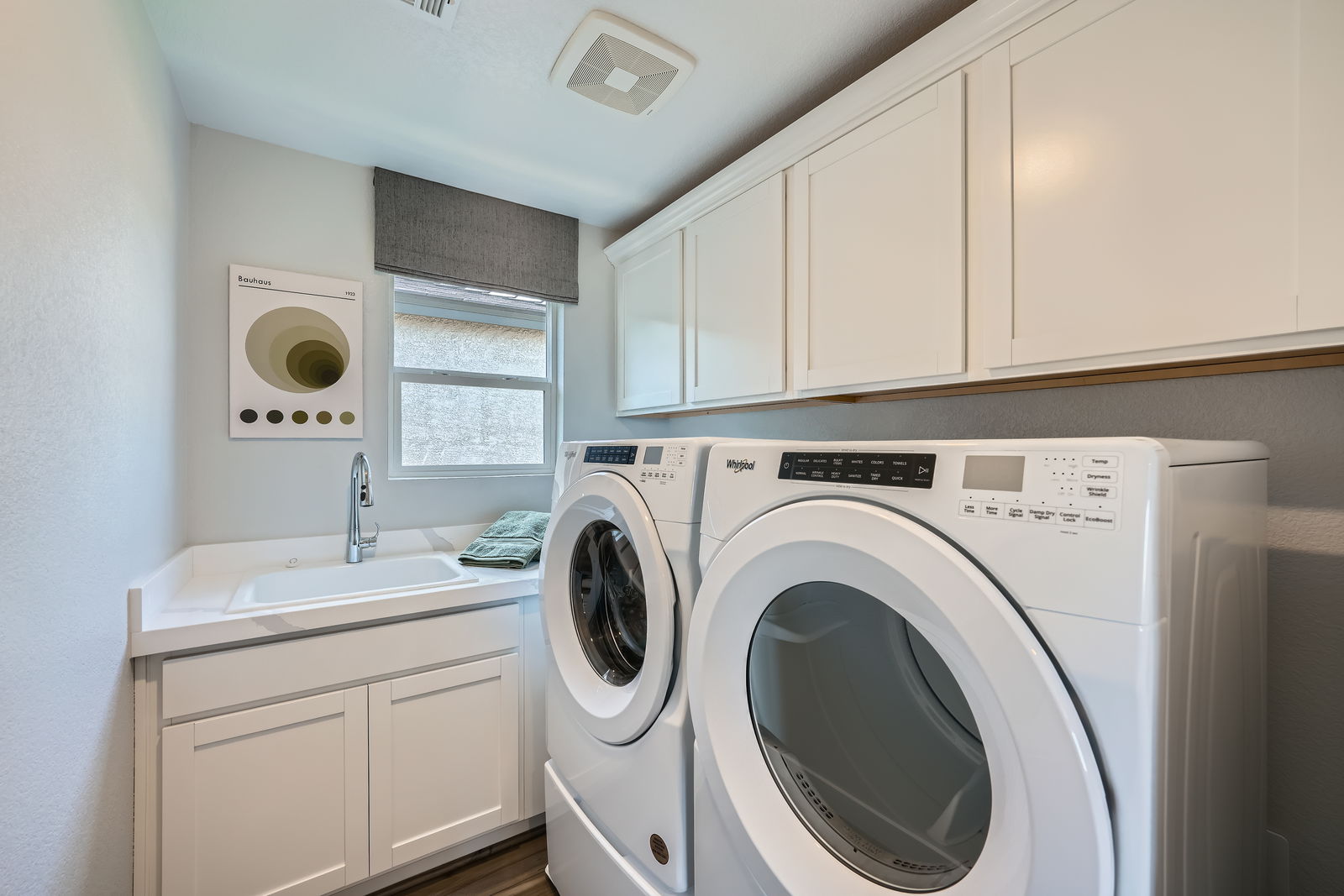 A washing machine in a kitchen.