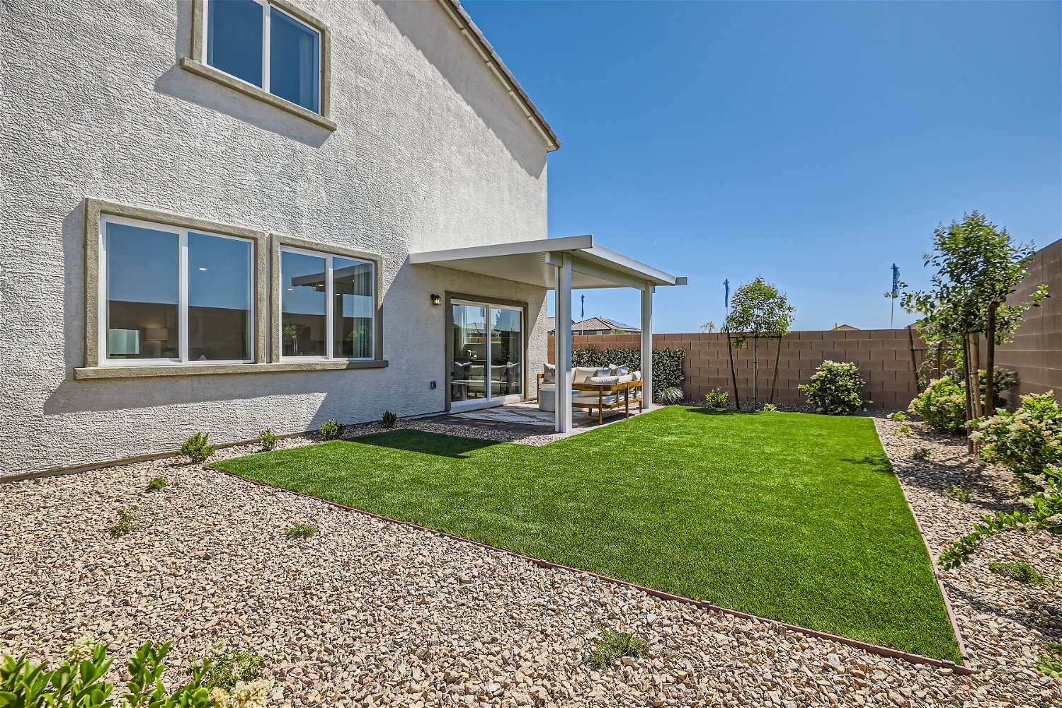 A house with a yard and a fence.