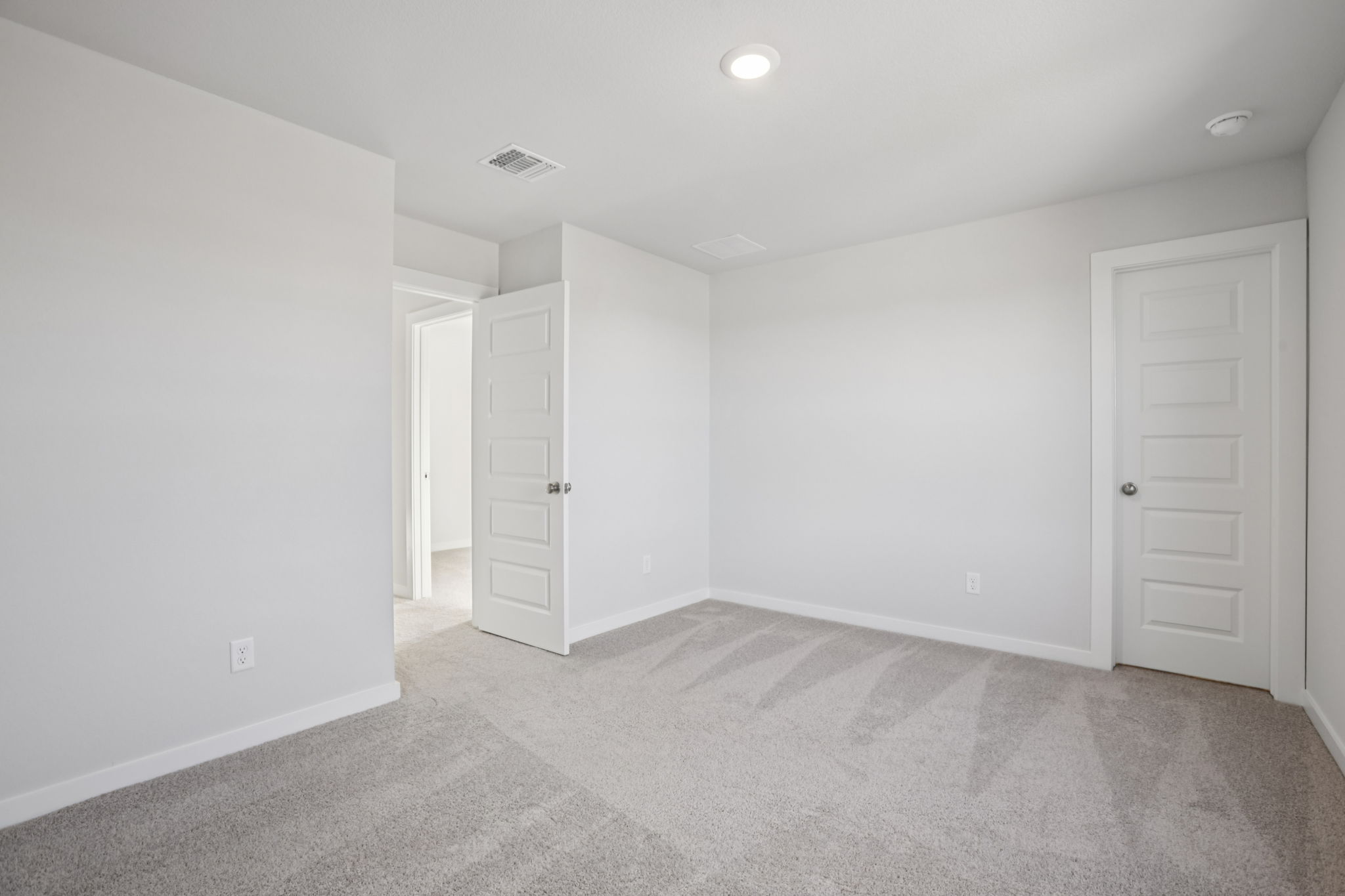 A room with white doors.