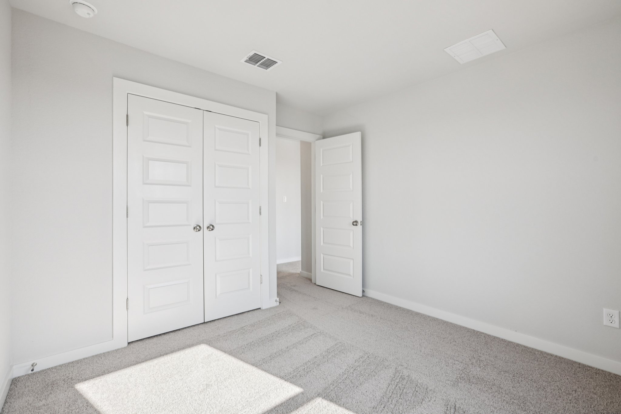 A room with white doors.
