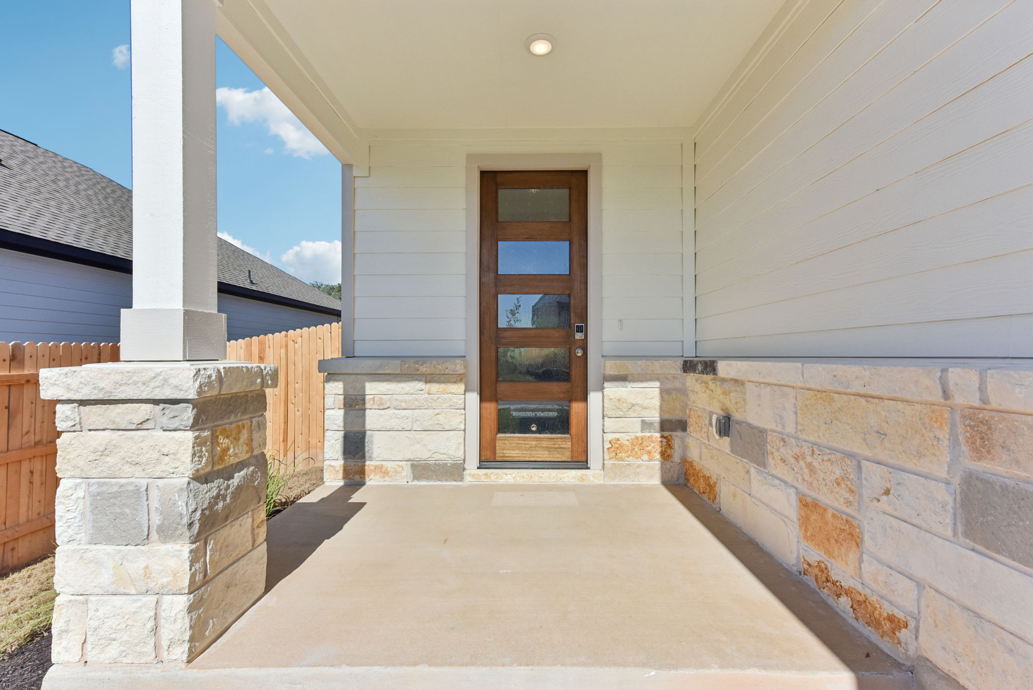 A house with a stone patio.