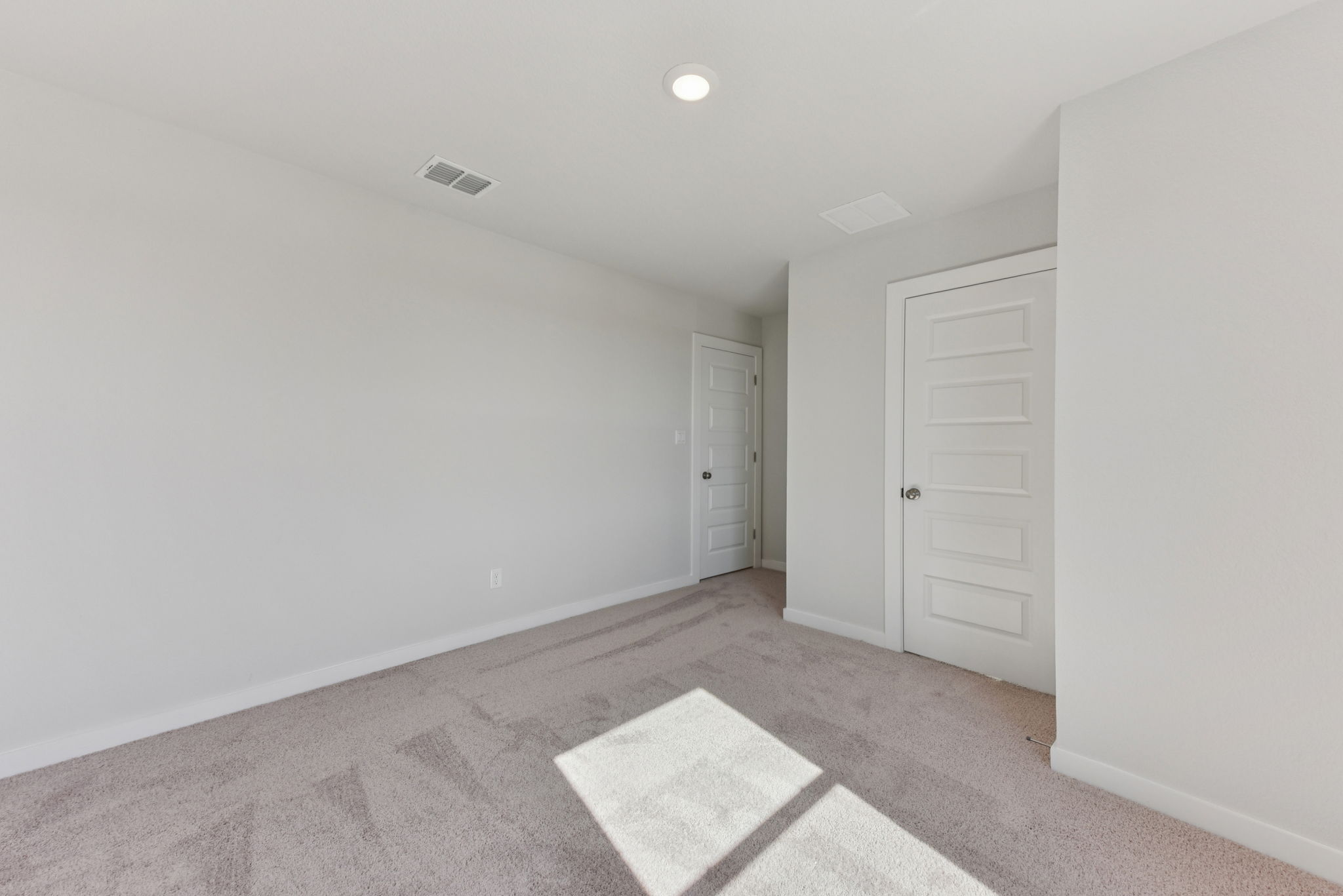 A room with white doors.