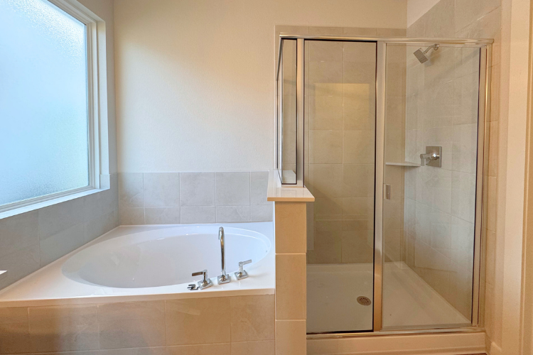 A bathroom with a glass shower.