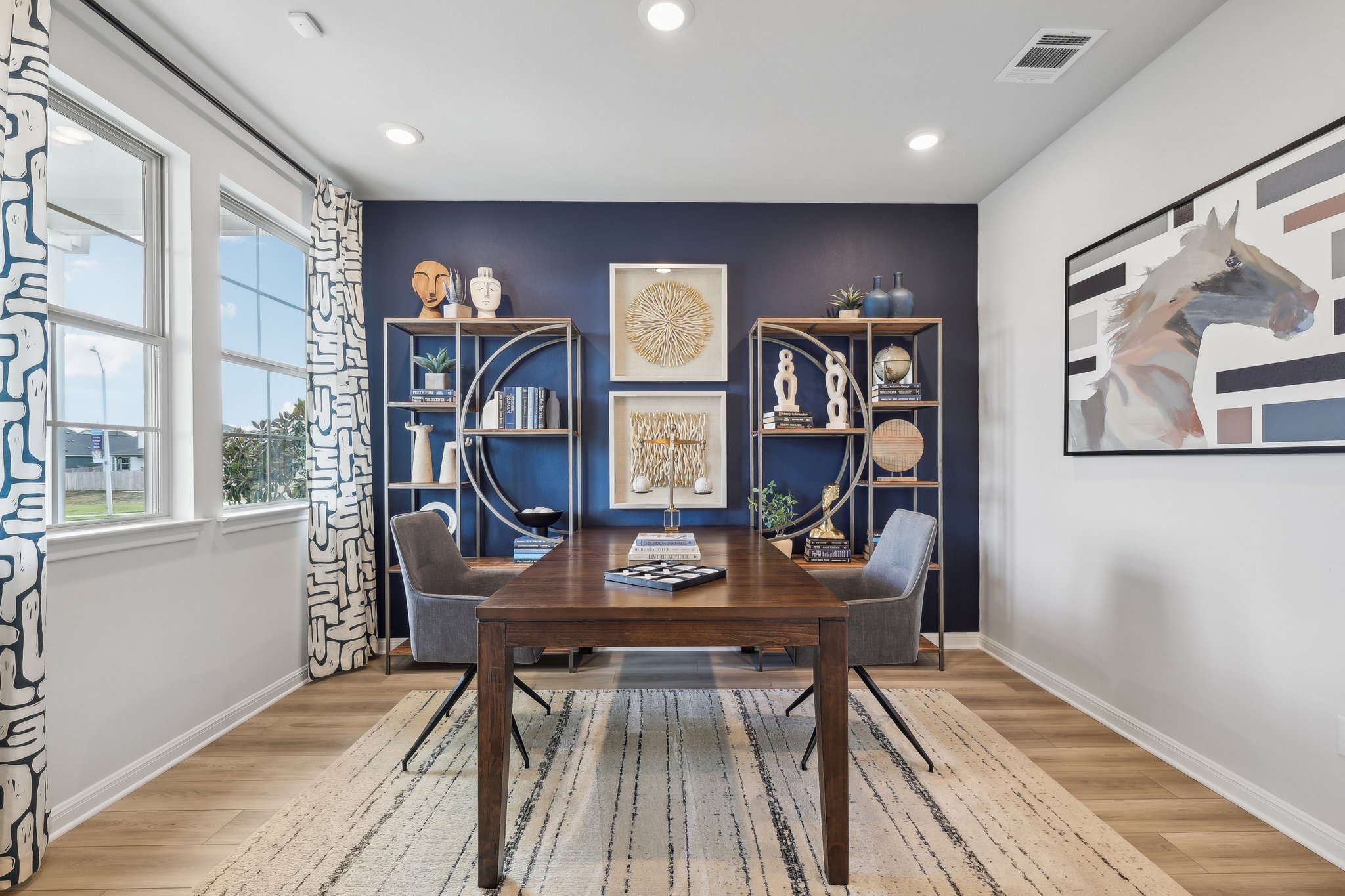 A room with a table and chairs.