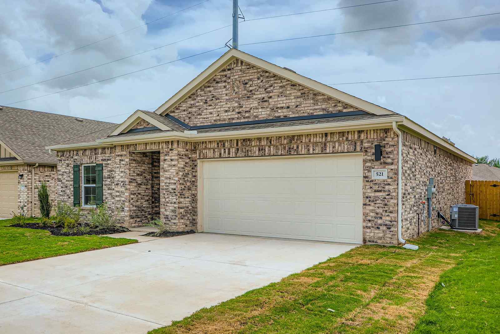 A brick building with a garage.