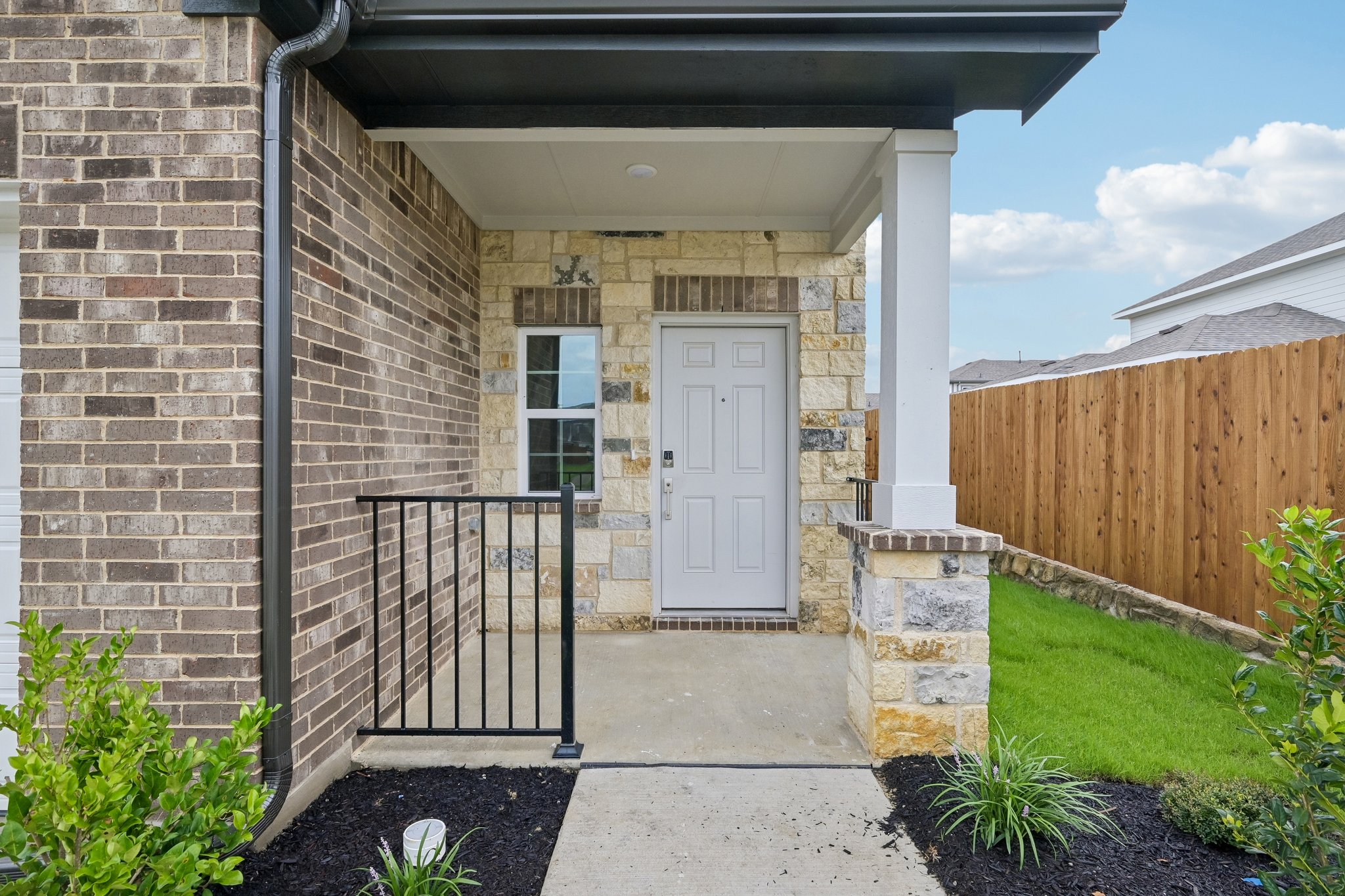 A brick building with a gate.
