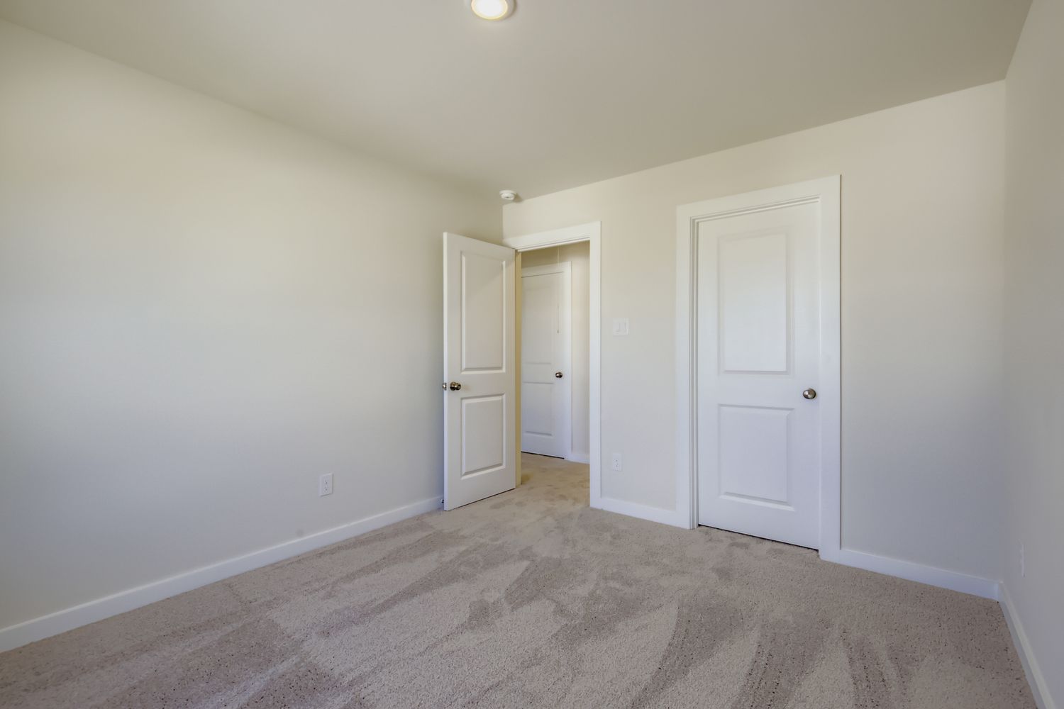 A room with white doors.