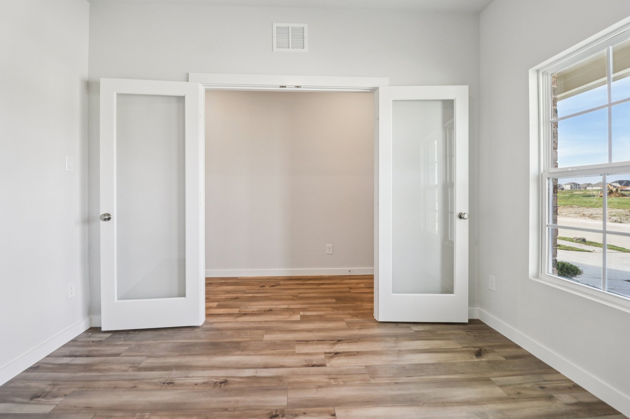 A room with white doors.