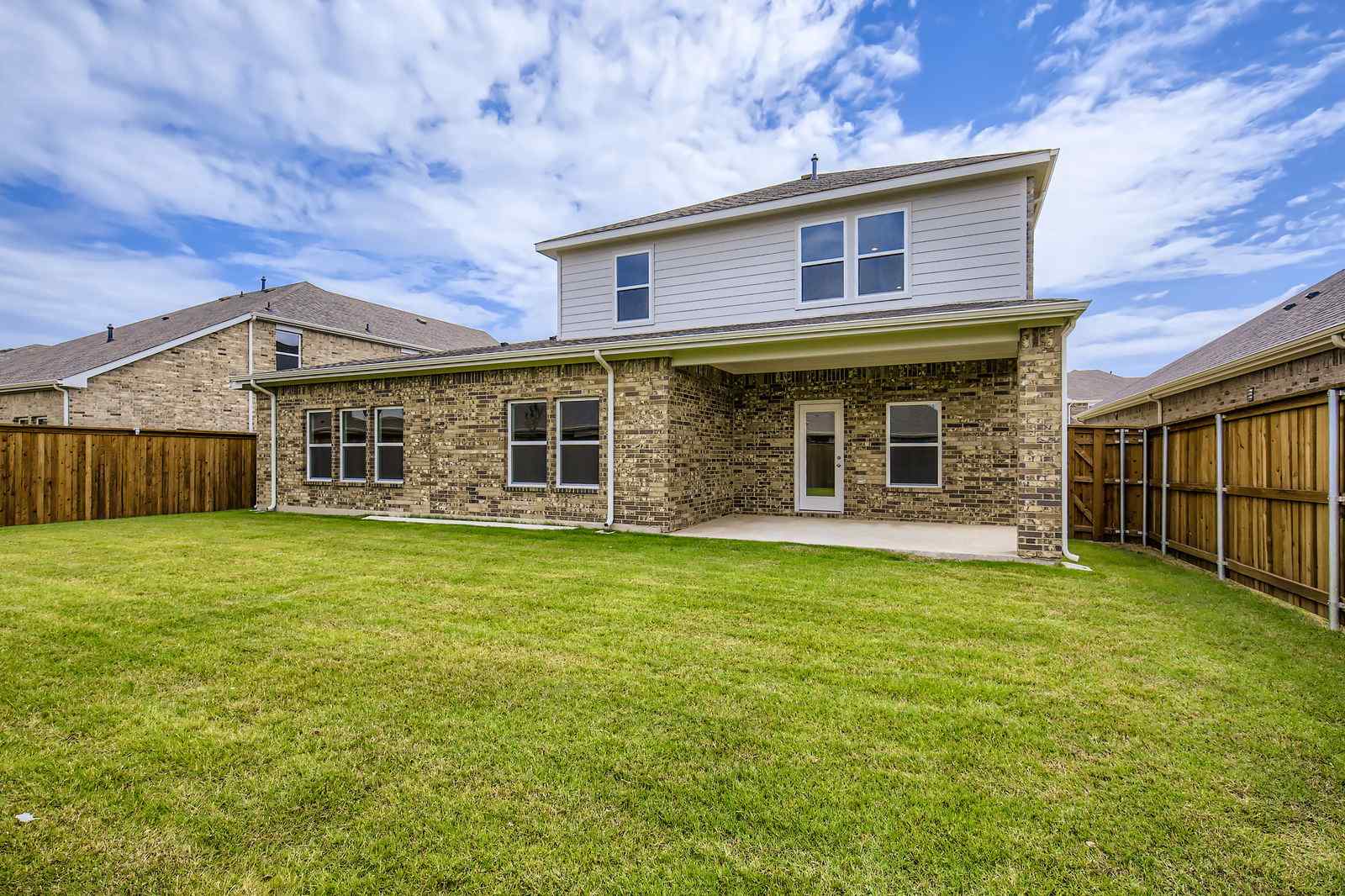A house with a grass yard.