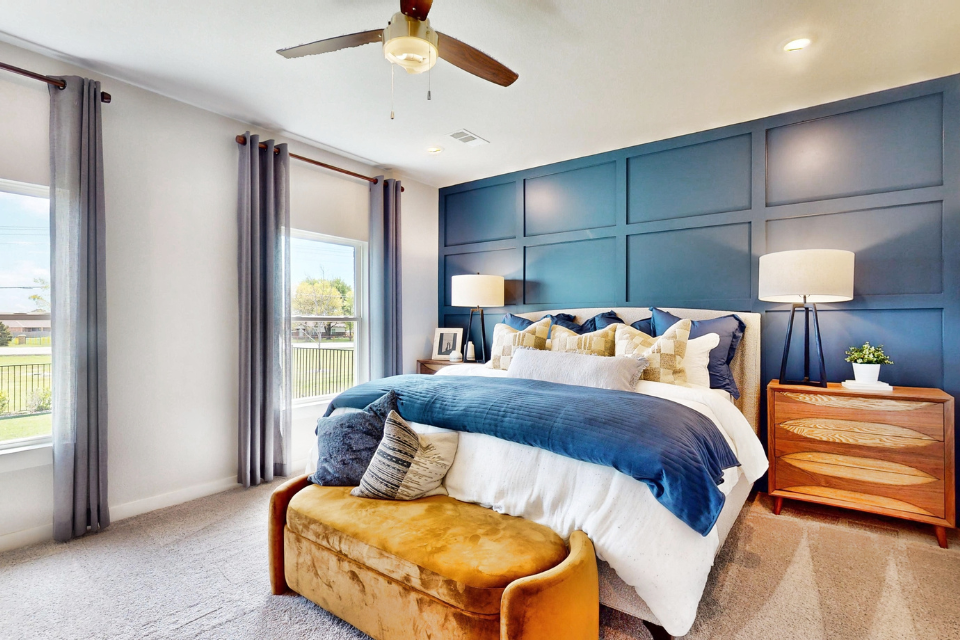 A bedroom with a large bed.