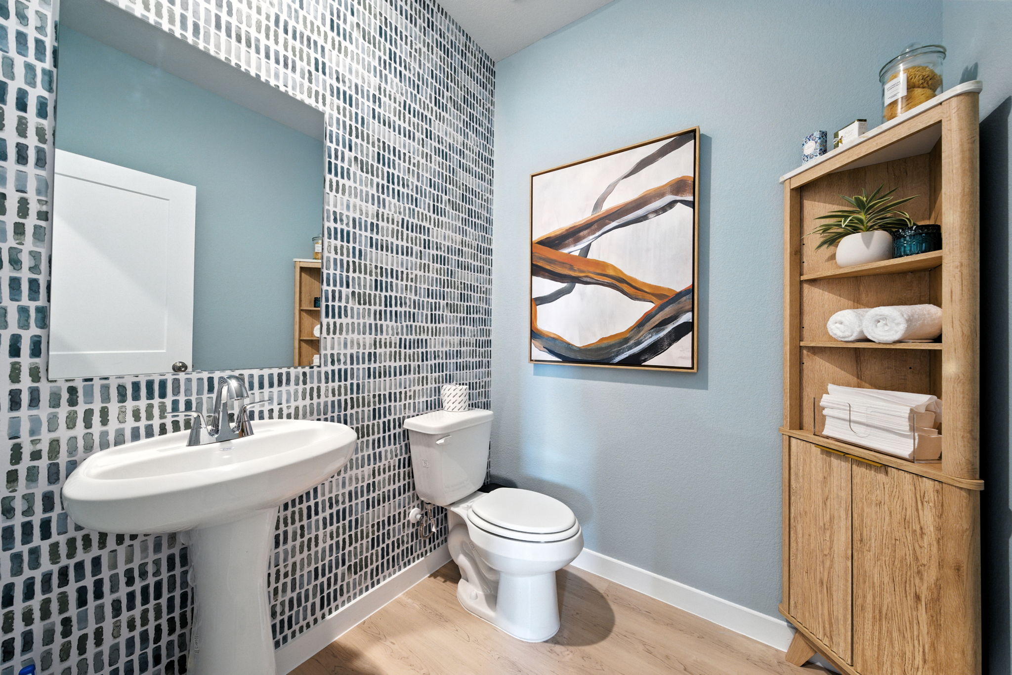 A bathroom with a sink and a toilet.