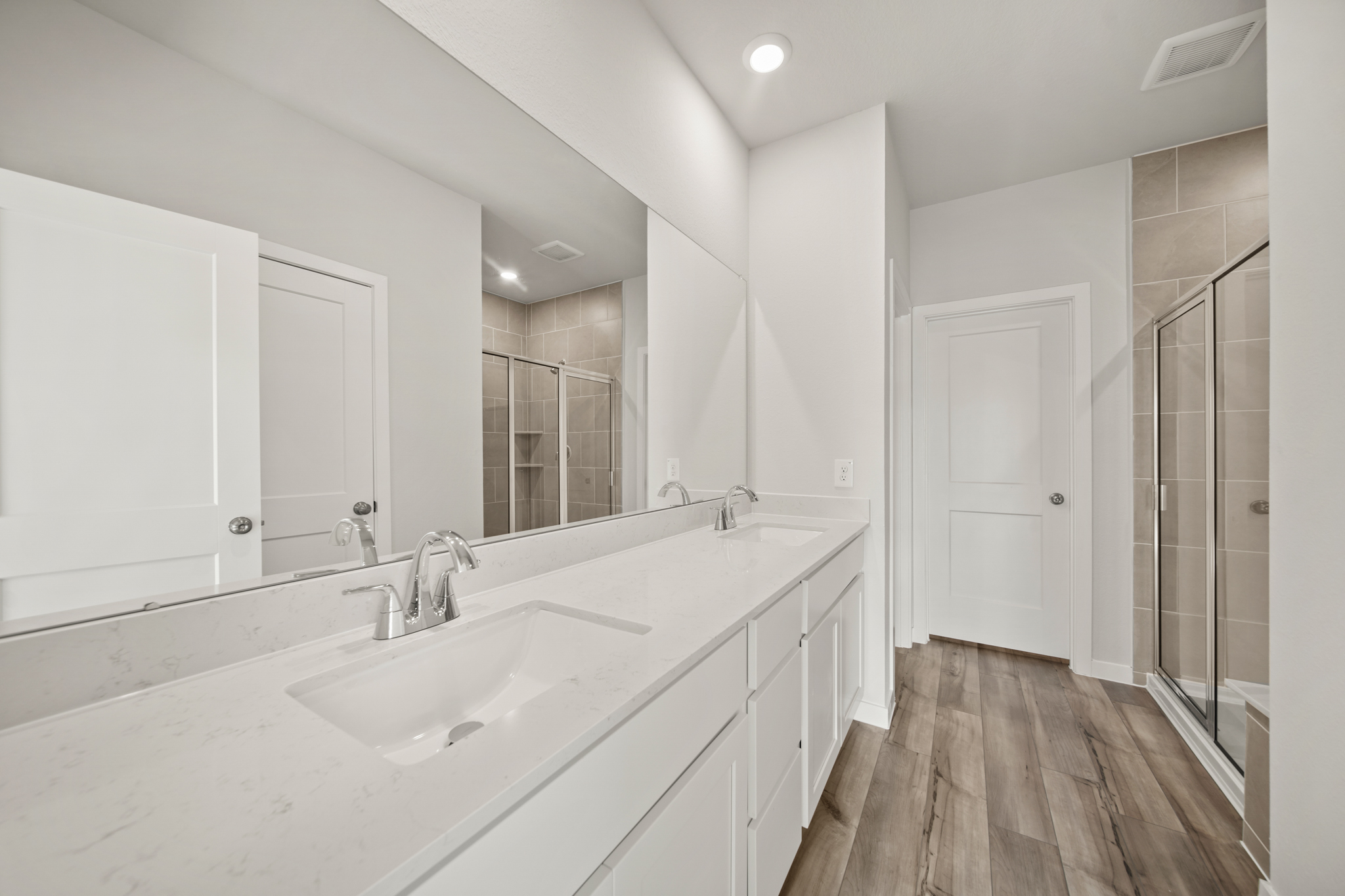 A bathroom with a glass shower.