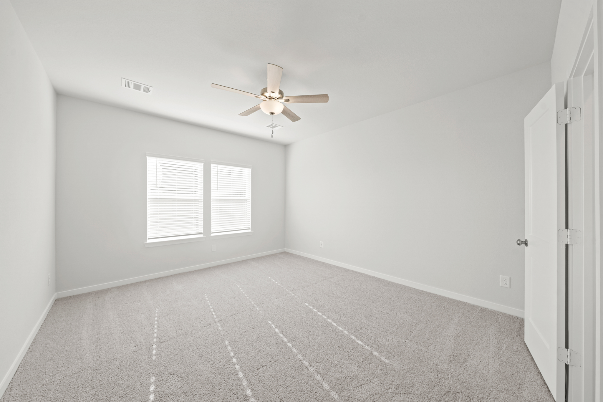 A ceiling fan in a room.