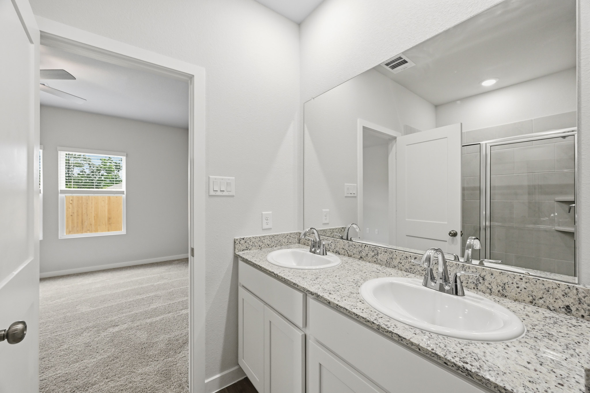 A bathroom with two sinks.