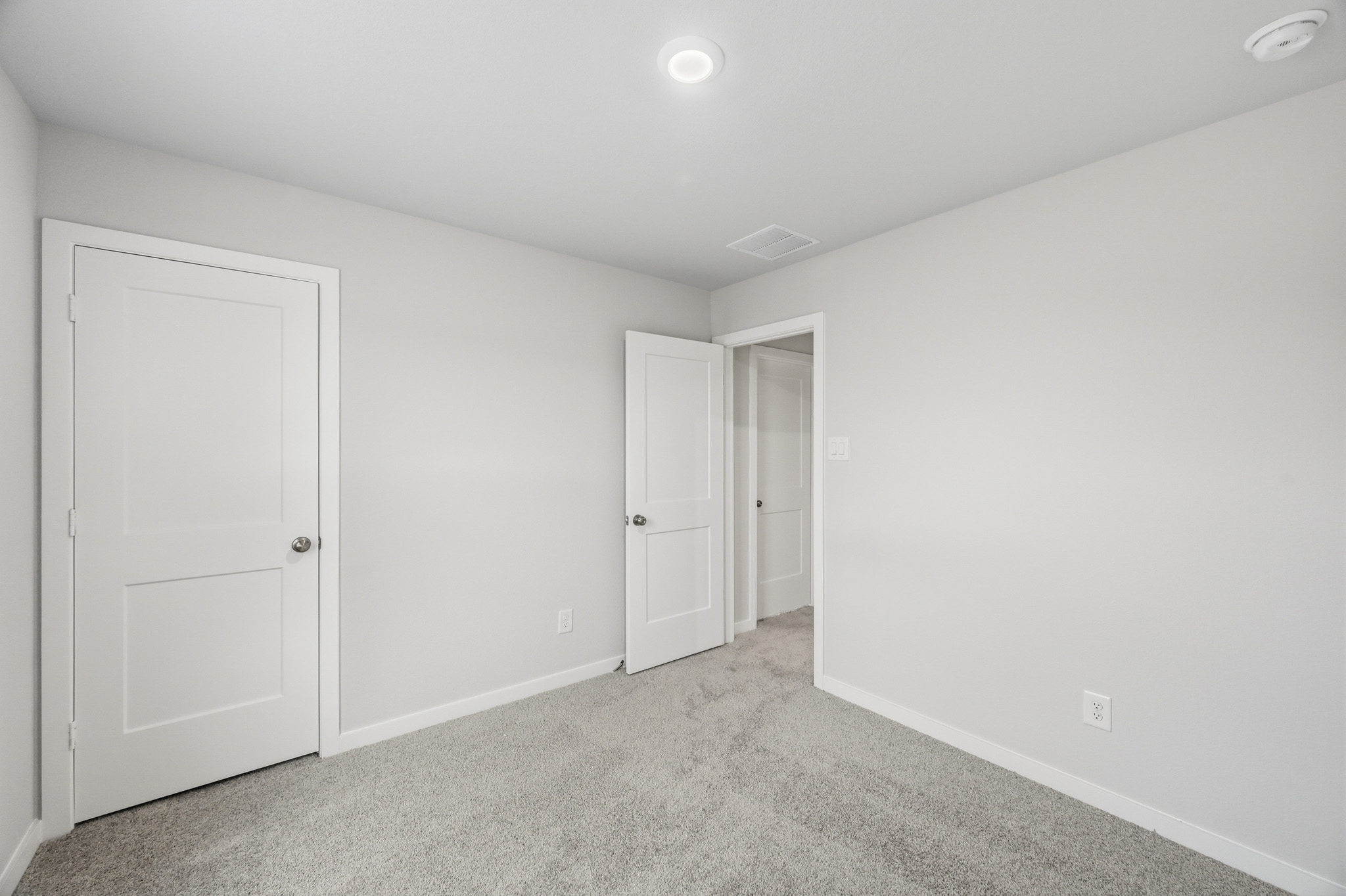A room with white doors.