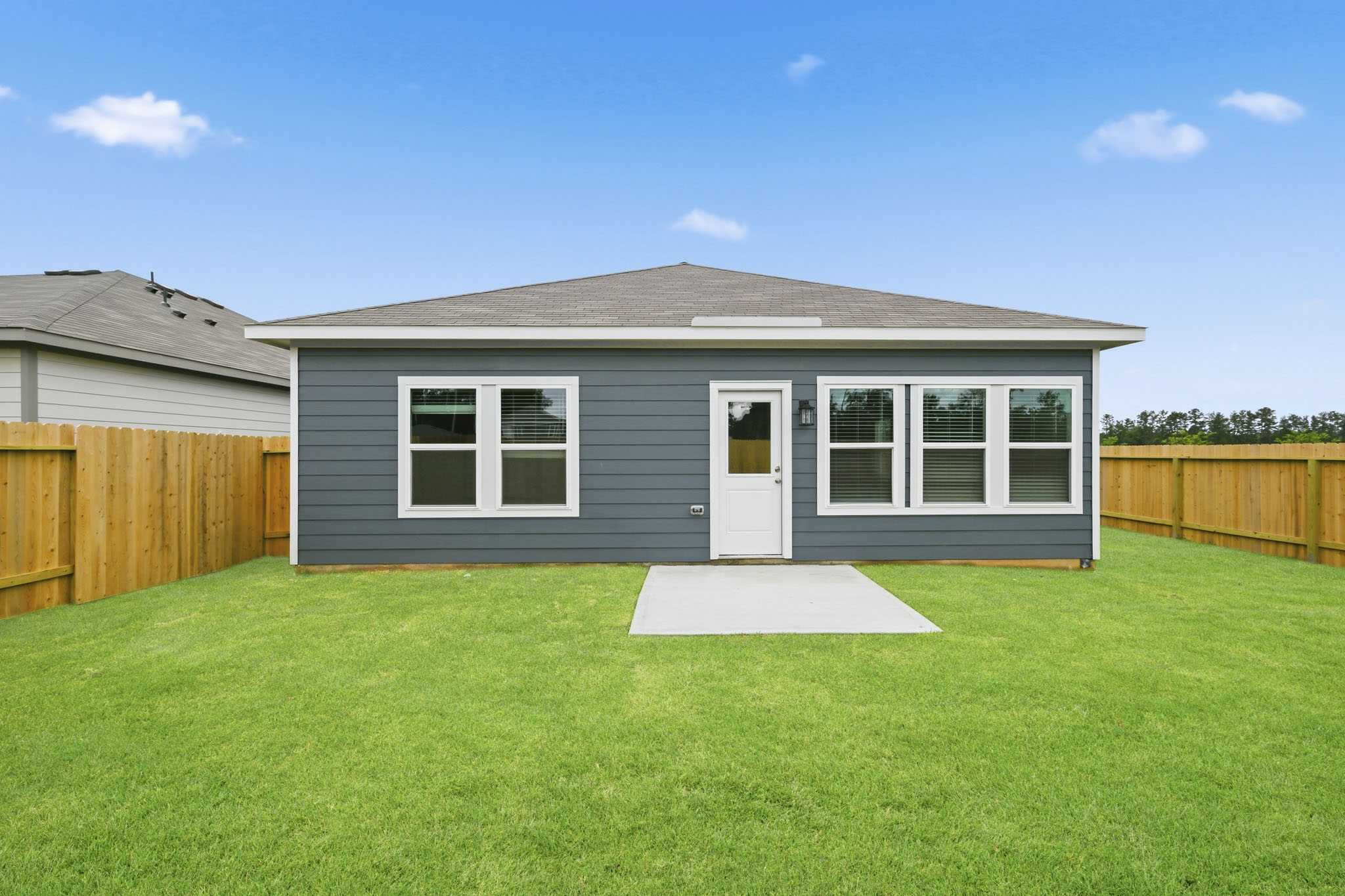A house with a grass yard.